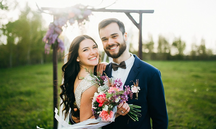 smiling bride and groom