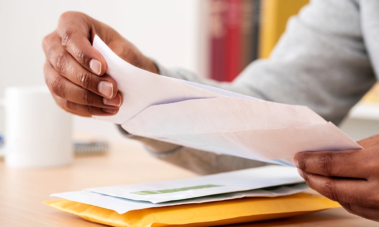person hopening mail